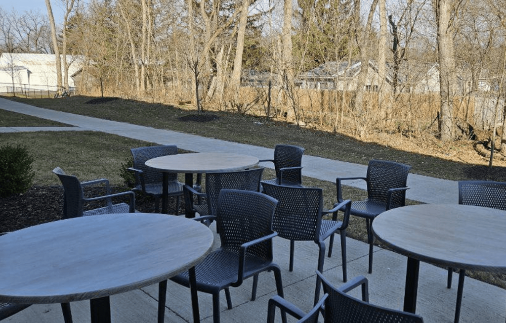a group of tables and chairs on a patio