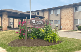 a sign in front of a building