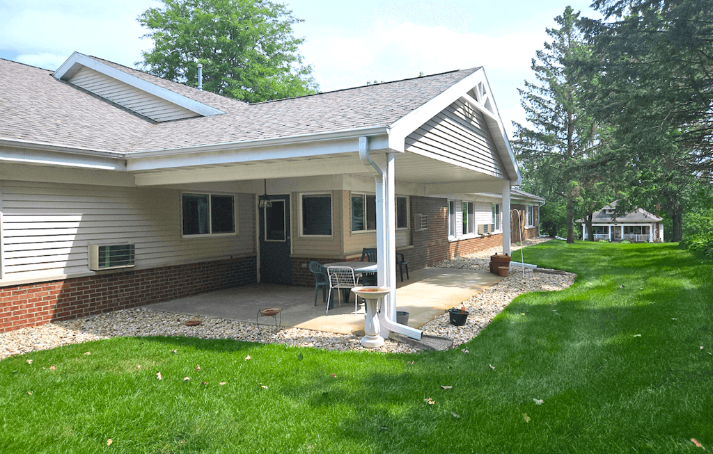 a patio with a table and chairs on it