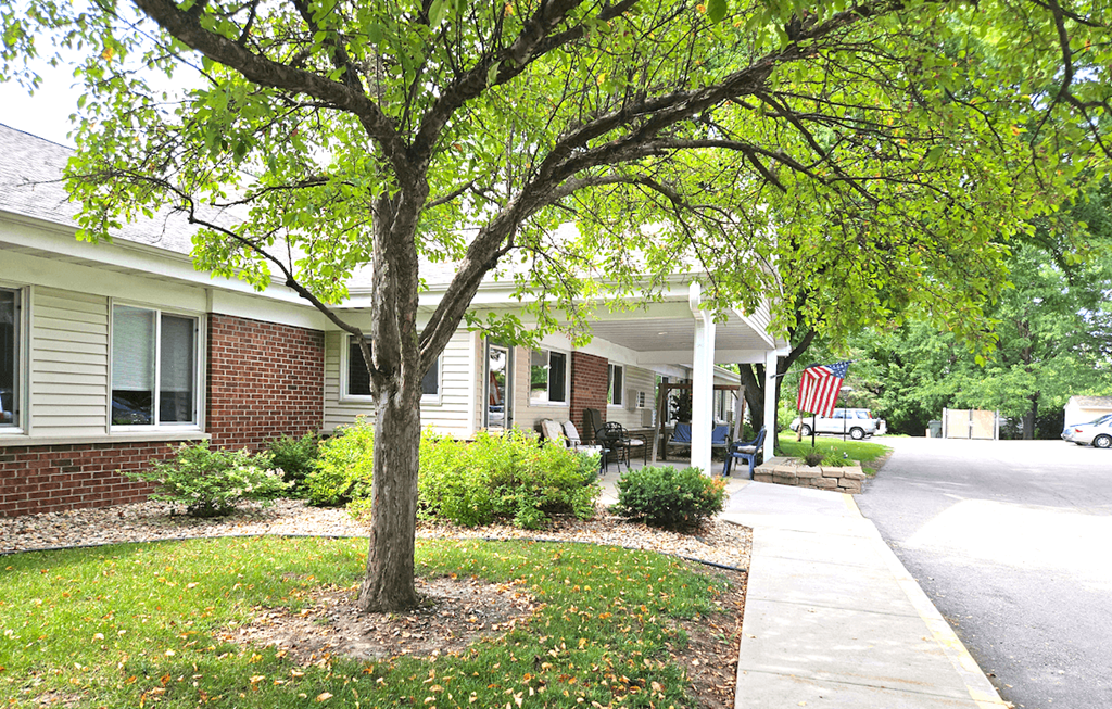 a tree in front of a house