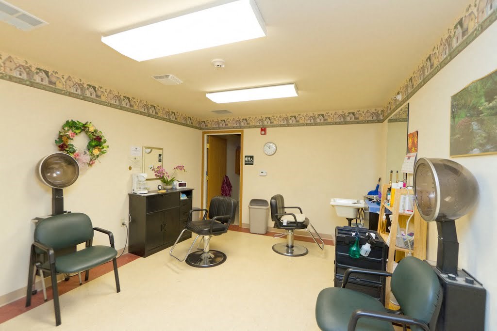 a dental room with chairs and a fan
