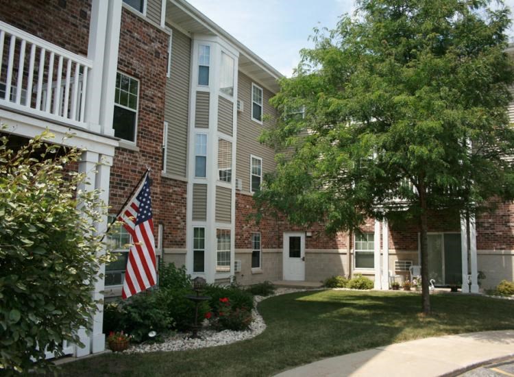 an flag in front of an apartment building