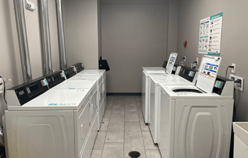 A row of washing machines in a laundromat.