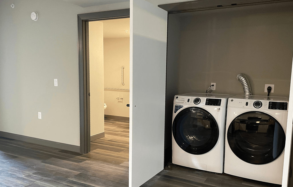 a laundry room with a washer and dryer