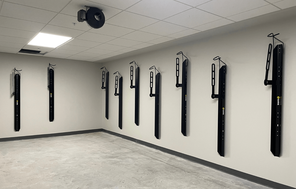 a large room with several different types of knives hanging on the wall