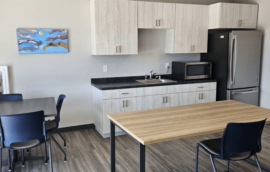 a kitchen and dining area in a hotel room