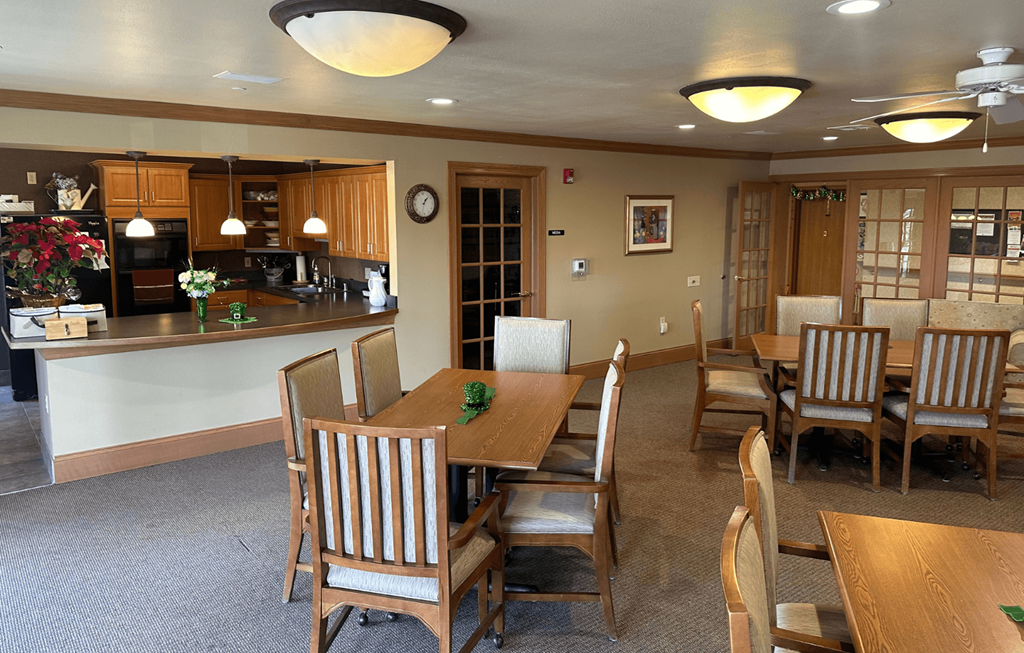 A dining room with a table set for six.