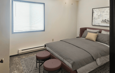 A bedroom with a bed, two stools, and a window.