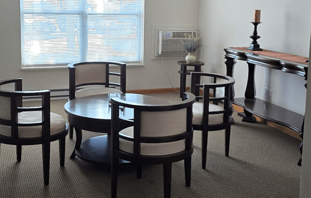 A set of chairs and a table are arranged in a room.