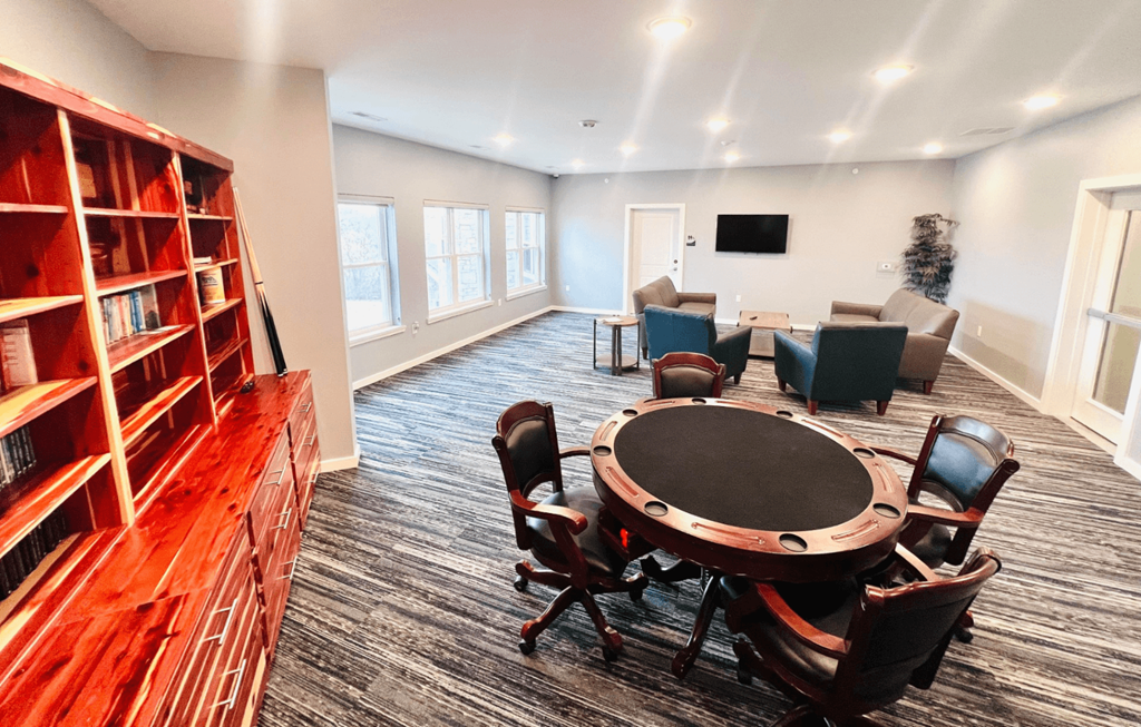 a conference room with a round table and chairs
