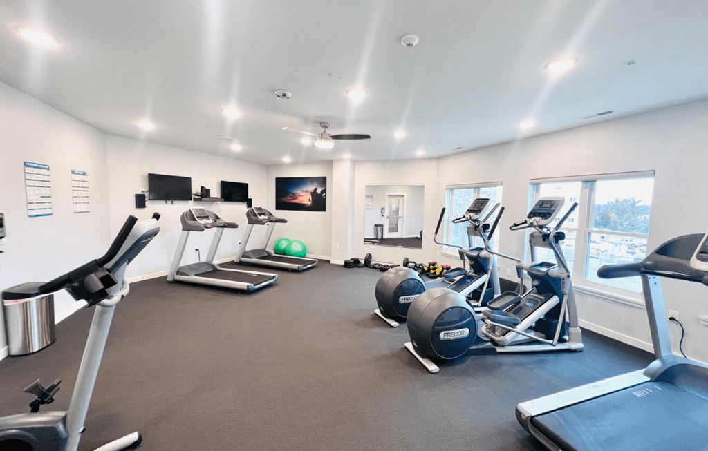 the gym is equipped with state of the art equipment including cardio machines and weights