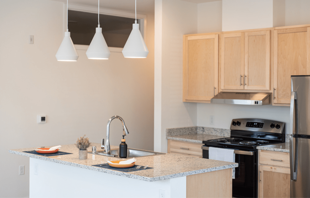 a kitchen with a granite counter top and a sink