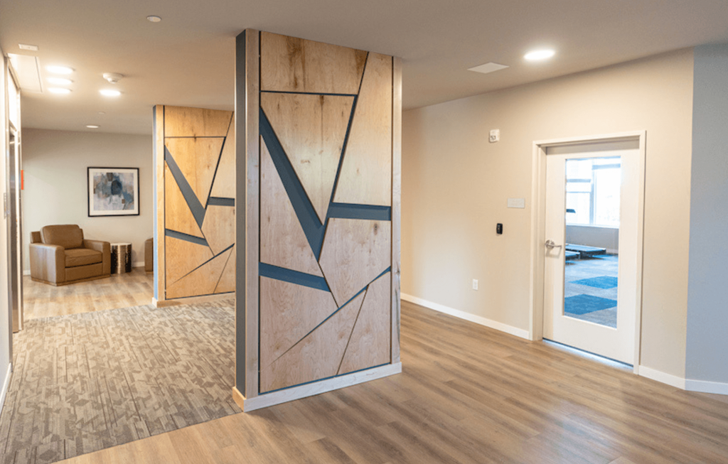 an open living room with a sliding barn door