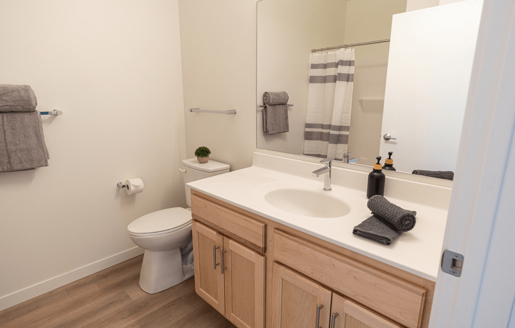 an empty bathroom with a sink and a toilet