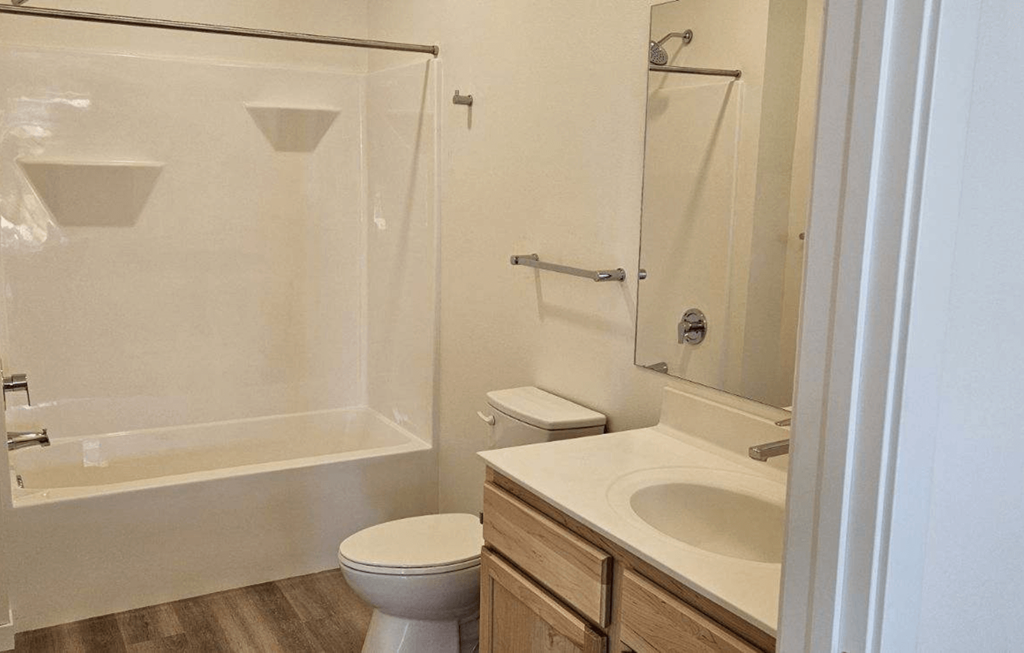 a bathroom with a sink toilet and a shower