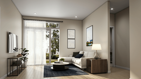 A modern living room with a white sofa and a coffee table.