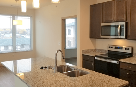 a kitchen with granite counter tops and a sink