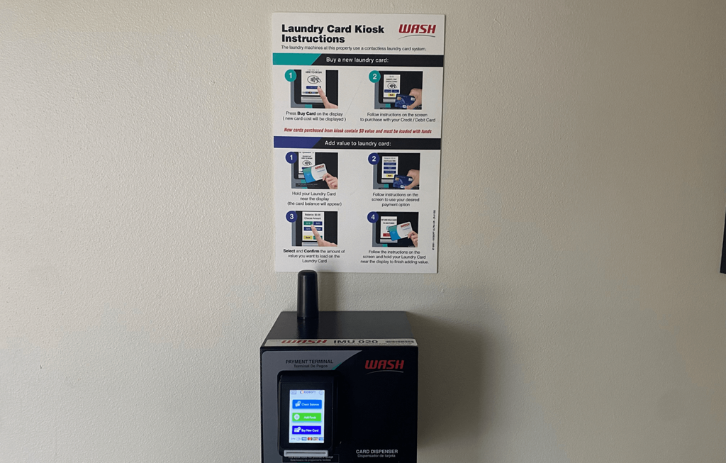 A WASH machine with instructions on how to use the card kiosk.