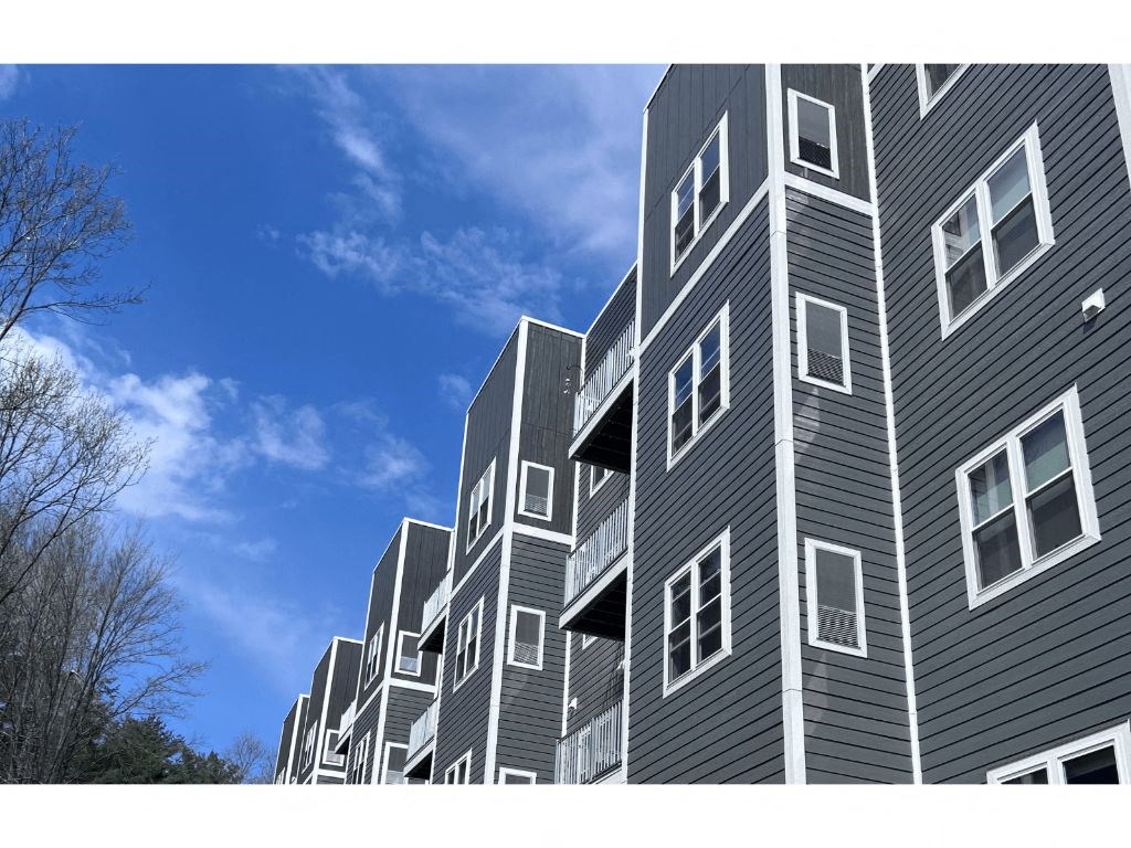 a picture of a building with a blue sky in the background