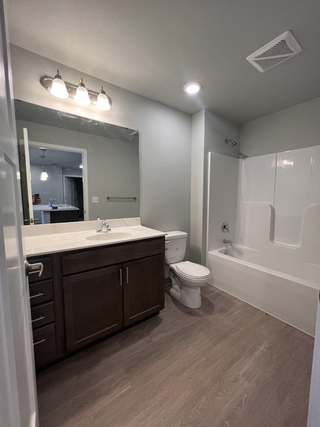 a bathroom with a toilet sink and bathtub