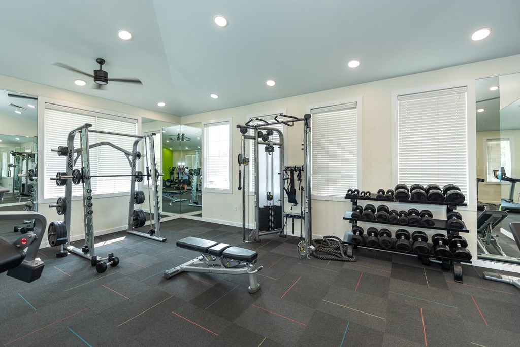 a home gym with weights and other exercise equipment