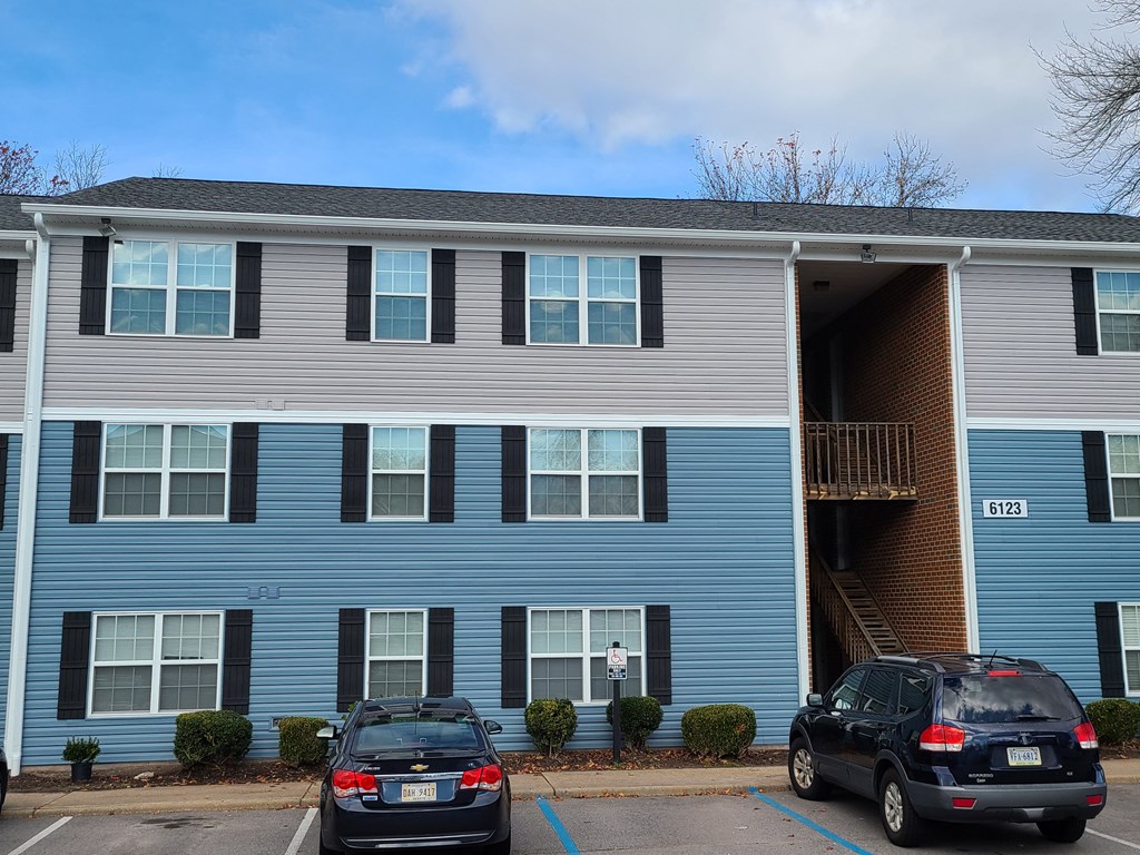 Outside view of building and parking at Brittany Place Apartments in Norfolk VA