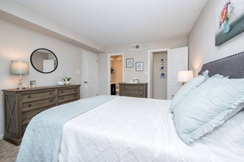 Brittany Place Apartments in Norfolk VA bedroom Spacious bedroom with entrance to closet and bathroom at Brittany Place Apartments in Norfolk VA - Photo Gallery 4
