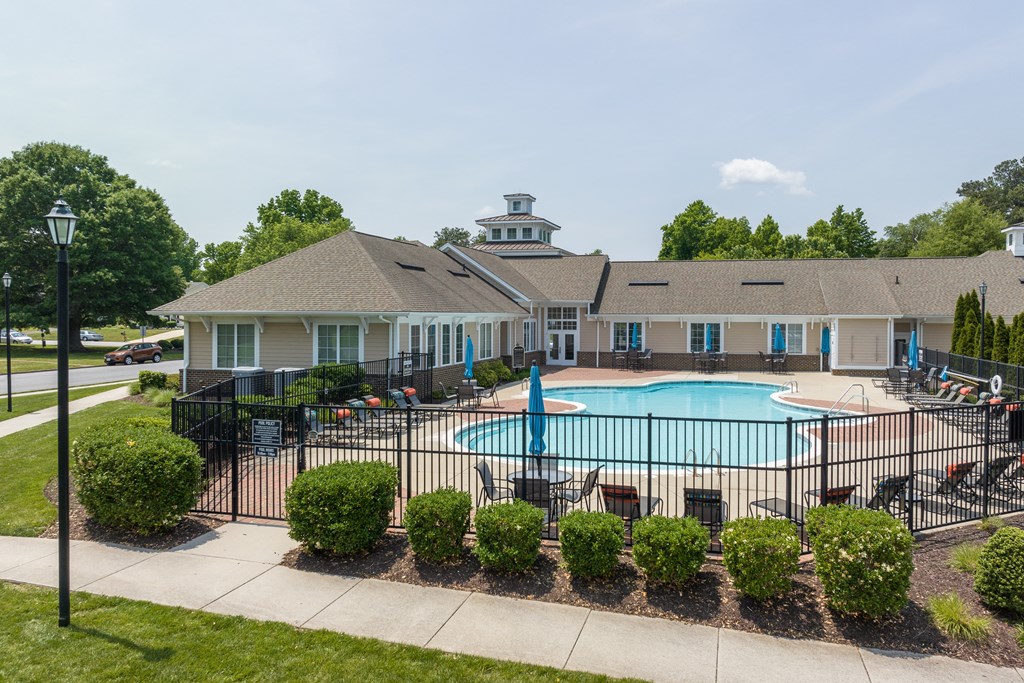 our apartments have a large pool with a black wrought iron fence
