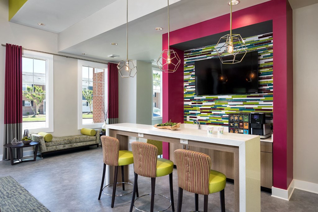 a living room with a bar and a television
