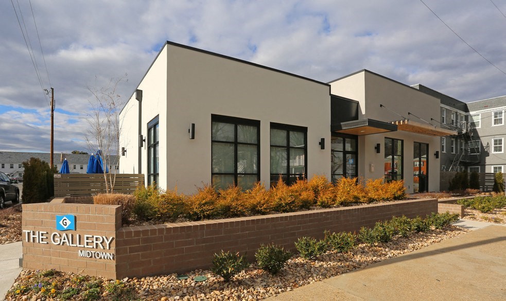 Front of clubhouse with windows at The Gallery Midtown Apartments in Richmond, VA