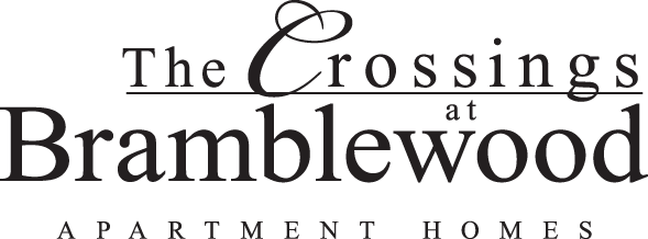 The image is a logo for a place called "The Crossings at Bramblewood Apartment Homes".