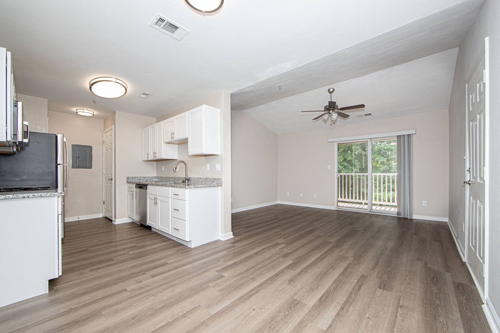 a kitchen and living room in a 555 waverly unit