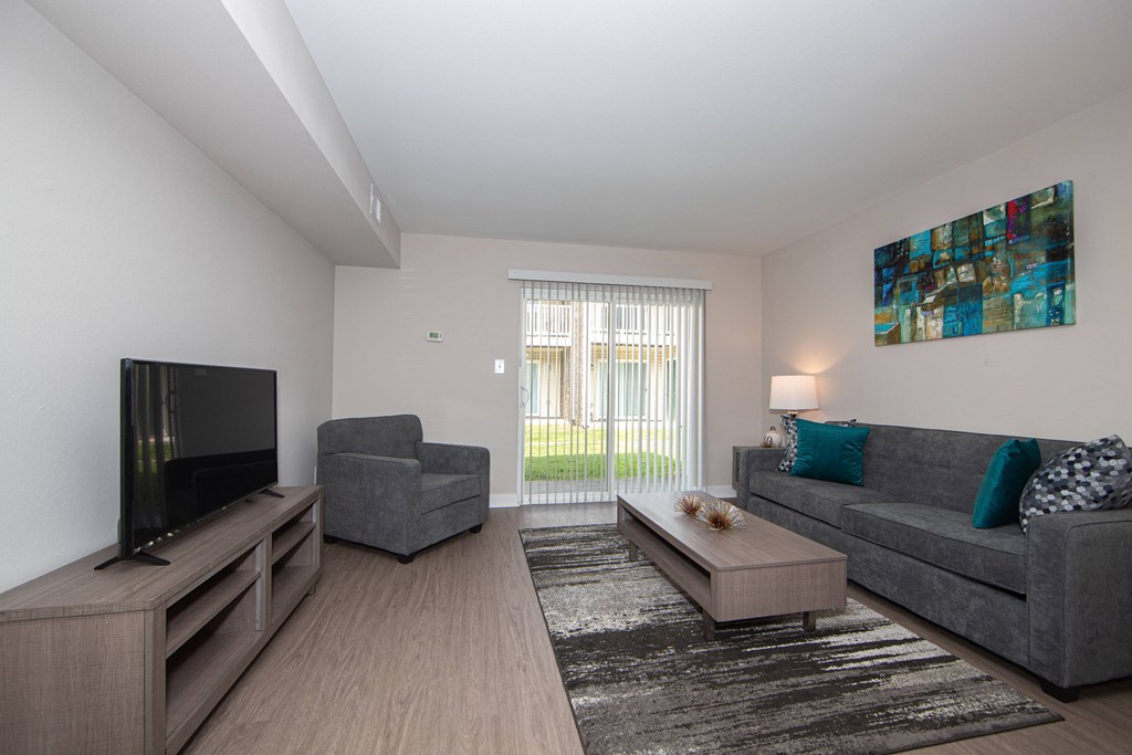 Spacious living room with plush carpet