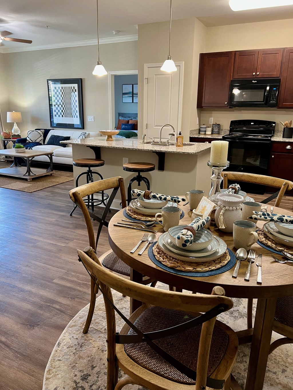 an open concept kitchen and living room with a dining table and chairs