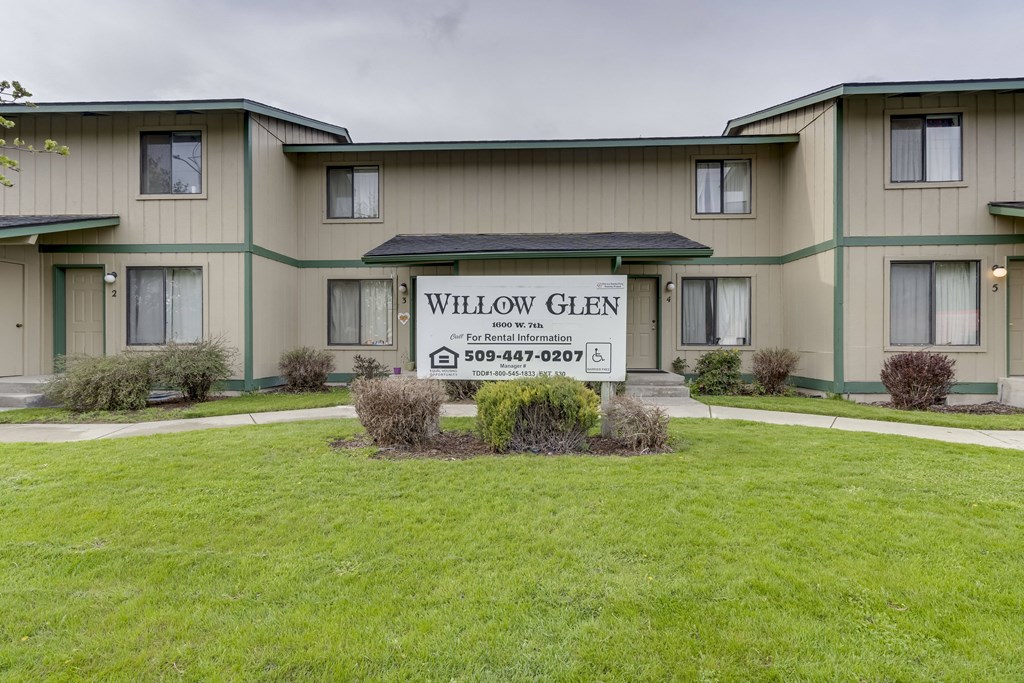a building with a sign that reads willow glen apartments