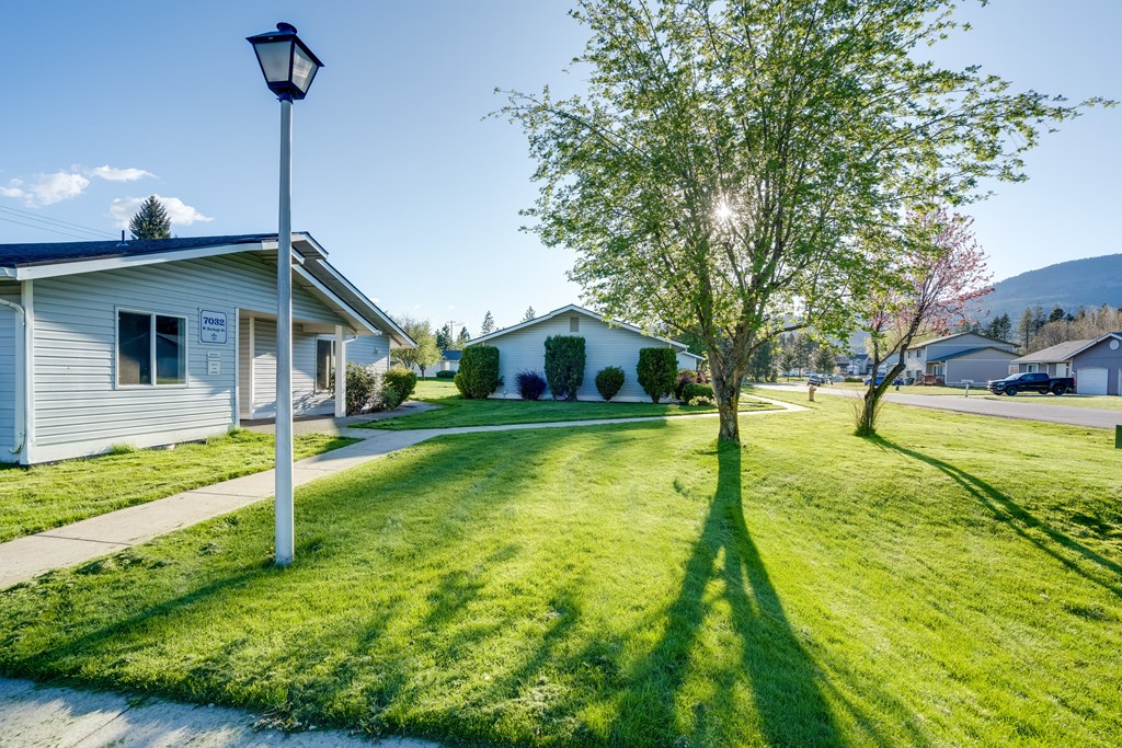 a house with a yard and a lamp post