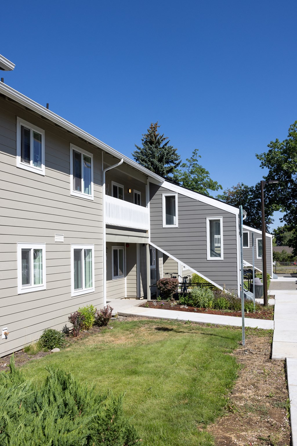 a row of houses on the side of a street