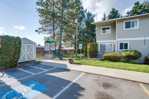 the preserve at ballantyne commons street entrance to apartment building with playground