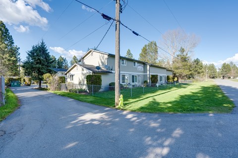 a house on the side of a street with a street light