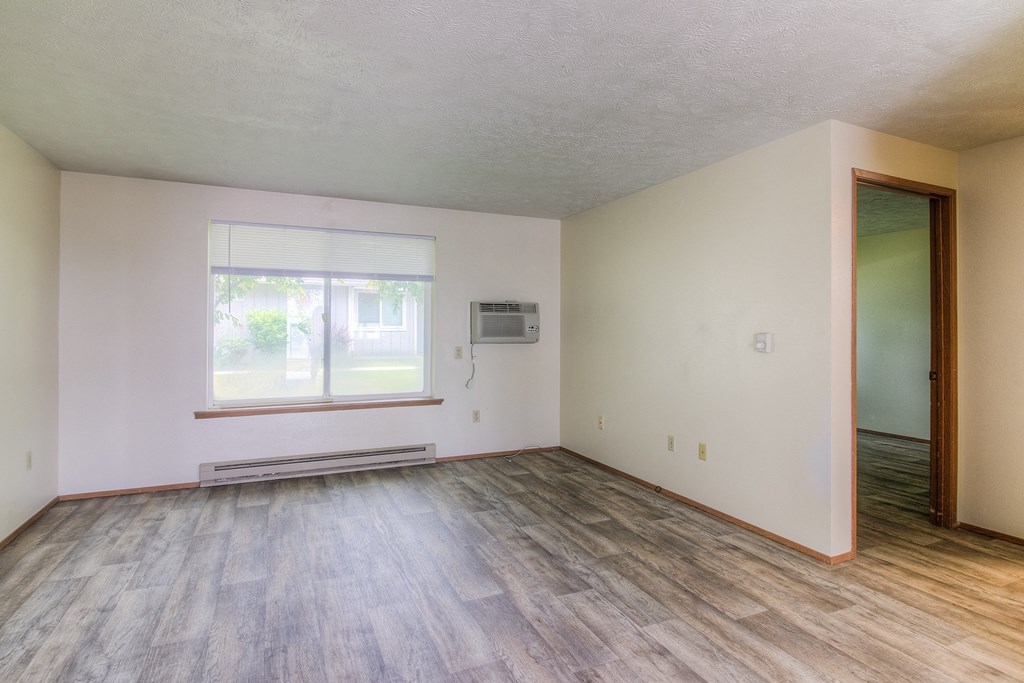 A room with a window and a door.