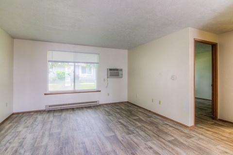 A room with a window and a door.