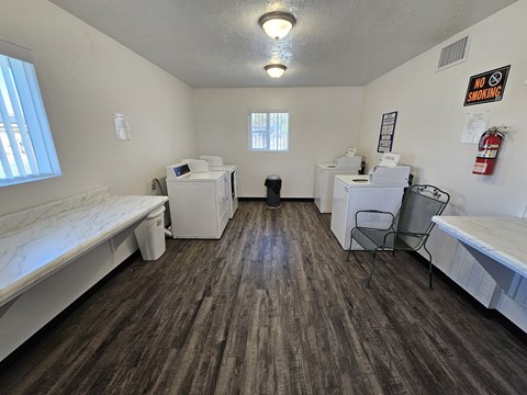 A laundry room with washers and dryers.
