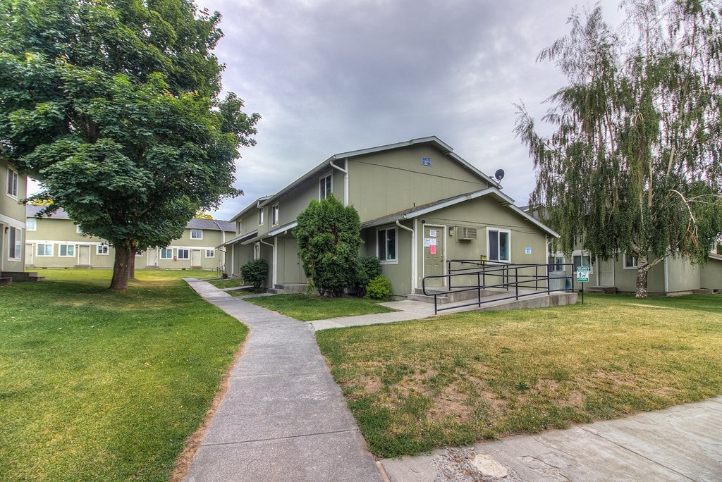 A residential area with houses and a walkway.