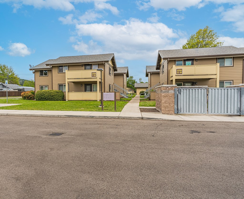 an apartment building on the side of a street