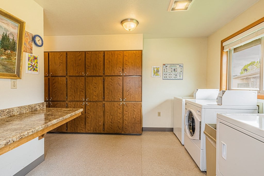 the laundry room has a washer and dryer and plenty of space for laundry