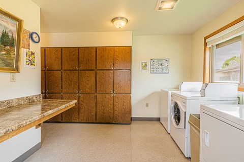 the laundry room has a washer and dryer and plenty of space for laundry