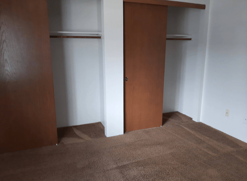 Example of a bedroom with closets in a unit at Eagle Cap Pineview Apartments in Joseph, Oregon