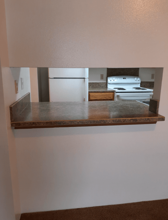 View of the Dining Room looking into the Kitchen in a unit at Eagle Cap Pineview Apartments in Joseph, Oregon