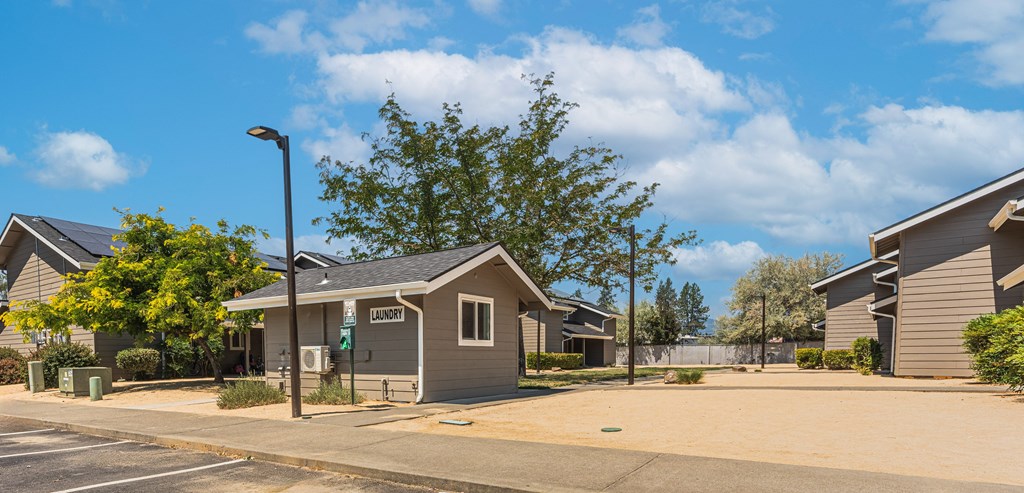an empty street in front of a row of houses