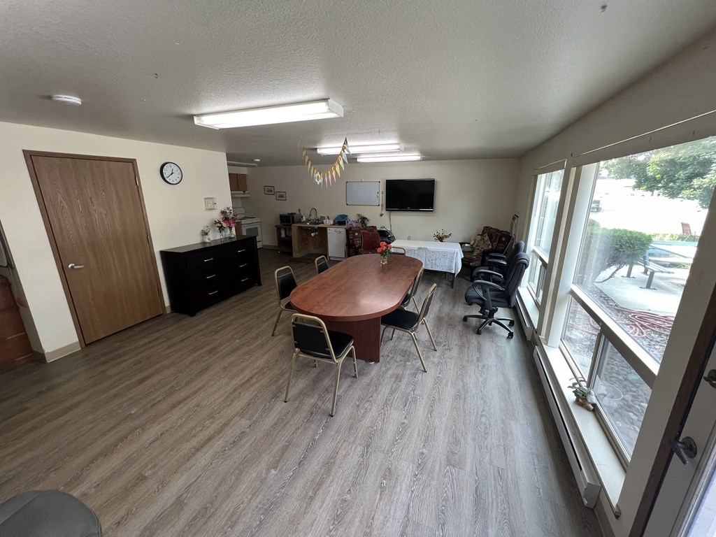 a view of the dining room and living room from the balcony
